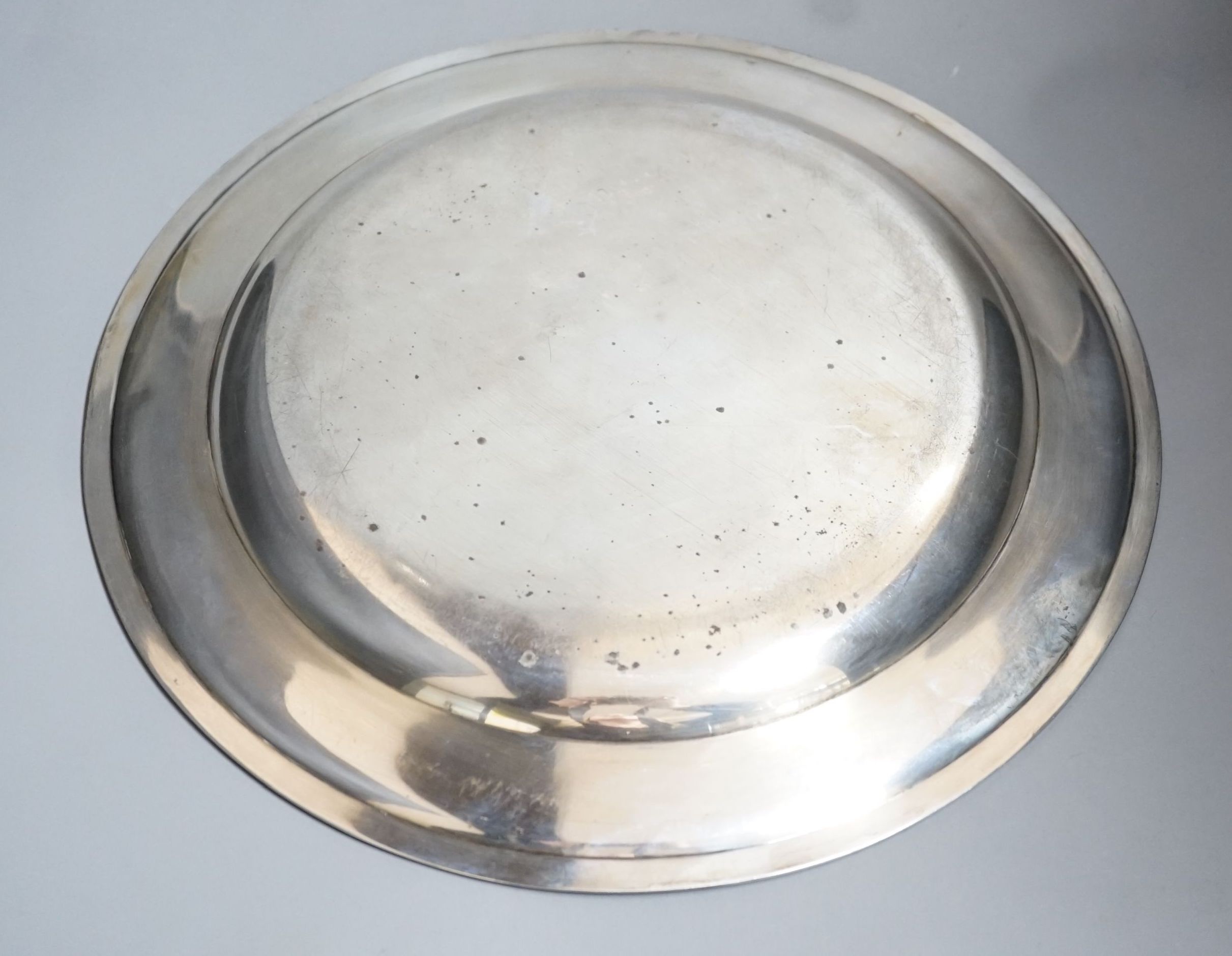 An Austro-Hungarian white metal circular dish with ribbon and reeded boarder, 34cm, 25oz.